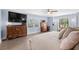 Serene bedroom with light blue walls, ceiling fan, and natural light at 160 Shipmaster Ave., Pawleys Island, SC 29585