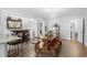 Bright dining room with wooden table, bar area, hardwood floors, and ample space for entertaining at 160 Shipmaster Ave., Pawleys Island, SC 29585