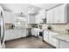 Modern kitchen features stainless appliances, tile backsplash, and ample counter space at 160 Shipmaster Ave., Pawleys Island, SC 29585