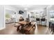 Bright, modern kitchen with wooden dining table and benches at 160 Shipmaster Ave., Pawleys Island, SC 29585