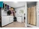 Laundry room featuring front load washer and dryer, utility sink, and shower stall at 160 Shipmaster Ave., Pawleys Island, SC 29585