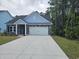 Attractive single-story house with a two-car garage, stone veneer, and a neat front lawn at 1848 Seachase Way, North Myrtle Beach, SC 29582