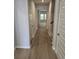Inviting hallway with wood flooring and neutral color scheme at 1848 Seachase Way, North Myrtle Beach, SC 29582