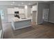 Bright, white kitchen with a large center island, stainless steel appliances and ample cabinet space at 1848 Seachase Way, North Myrtle Beach, SC 29582