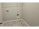 Laundry room with marble style tile floor and utility connections at 1848 Seachase Way, North Myrtle Beach, SC 29582