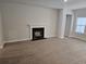 Spacious living room with a cozy fireplace and ample natural light from the large window at 1848 Seachase Way, North Myrtle Beach, SC 29582