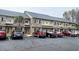 Charming townhome featuring manicured landscaping, brick accents, and convenient parking at 200 Double Eagle Dr. # D3, Surfside Beach, SC 29575