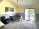 Bright living room with slider doors to balcony, enhanced by natural light and neutral decor at 200 Double Eagle Dr. # D3, Surfside Beach, SC 29575