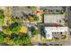 Overhead perspective of parking lots with parking space lines, nearby buildings, trees, and city streets at 2010 S Ocean Blvd., Myrtle Beach, SC 29577