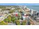 Aerial view of condo building and parking lot in a beach town, with the ocean in the background during a sunny day at 2010 S Ocean Blvd., Myrtle Beach, SC 29577