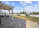 A spacious backyard patio leads to a playset and trampoline perfect for outdoor activities and Gathering fun at 206 Math Place, Longs, SC 29568