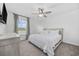 Inviting bedroom featuring a ceiling fan, neutral color scheme, and plenty of natural light at 206 Math Place, Longs, SC 29568