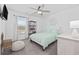 Cozy bedroom with a ceiling fan, natural light, and stylish decor at 206 Math Place, Longs, SC 29568