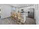 Modern kitchen with stainless steel appliances, granite countertops, and a breakfast bar at 206 Math Place, Longs, SC 29568