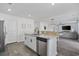 Bright kitchen features granite countertops, stainless steel appliances and breakfast bar at 206 Math Place, Longs, SC 29568