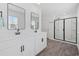 Elegant bathroom with double sink vanity, modern fixtures, and glass-enclosed shower at 206 Math Place, Longs, SC 29568