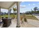 Inviting front porch with a seating area and lush landscaping at 206 Math Place, Longs, SC 29568