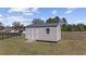 Exterior view of a backyard shed, perfect for extra storage and has double doors with a small ramp at 206 Math Place, Longs, SC 29568
