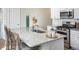 Modern kitchen island with granite countertops, stainless steel sink, and bar stool seating at 247 Warner Crossing Way, Loris, SC 29569