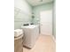Convenient laundry room features modern washer and dryer with wire shelving for storage solutions at 247 Warner Crossing Way, Loris, SC 29569