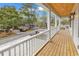 Relaxing balcony view of the neighborhood, with wood floors, stylish lighting, and a wood plank ceiling at 318 Vista Dr., Murrells Inlet, SC 29576