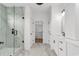 Bathroom featuring glass shower, marble tile floors and walk in closet at 318 Vista Dr., Murrells Inlet, SC 29576