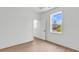 Bedroom features wood floors, white walls, bright light and open door at 318 Vista Dr., Murrells Inlet, SC 29576