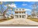 Beautiful two-story stilt home with a spacious driveway and double balconies, perfect for beach living at 318 Vista Dr., Murrells Inlet, SC 29576