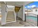 View of garage with access to the pool, and stairs leading to the elevated deck area of the home at 318 Vista Dr., Murrells Inlet, SC 29576
