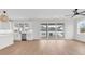 Open-concept living space with a modern kitchen, stainless steel appliances, and access to an outdoor balcony at 318 Vista Dr., Murrells Inlet, SC 29576