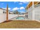 Private backyard pool with a brick patio surrounded by a white fence and lush landscaping at 318 Vista Dr., Murrells Inlet, SC 29576