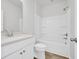 Bathroom with white fixtures, shower/tub combo, and wood look floors at 415 Joseph St, Longs, SC 29568
