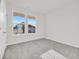 Sunny bedroom with plush carpet, neutral walls, and double windows at 415 Joseph St, Longs, SC 29568