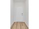 Front entryway with white door, wood flooring, and neutral walls at 415 Joseph St, Longs, SC 29568