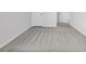 A hallway is brightly lit and features neutral colored carpet at 415 Joseph St, Longs, SC 29568