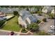 Aerial view of community clubhouse with manicured landscaping, parking, and surrounding residential buildings at 4603 Arran Ct. # C, Myrtle Beach, SC 29579