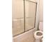 Bathroom toilet and glass enclosed tub-shower combination at 4603 Arran Ct. # C, Myrtle Beach, SC 29579