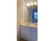 Bathroom vanity with a sink, mirror, and white cabinets offering storage space at 4603 Arran Ct. # C, Myrtle Beach, SC 29579