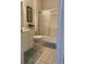 Bathroom with vanity, toilet, and glass enclosed tub-shower combination with tile floors at 4603 Arran Ct. # C, Myrtle Beach, SC 29579