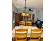 Cozy dining area with chandelier, table, and access to the living room at 4603 Arran Ct. # C, Myrtle Beach, SC 29579