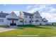 Exterior elevation showing a grand manor with manicured lawn and classic architecture, offering timeless elegance at 4603 Arran Ct. # C, Myrtle Beach, SC 29579