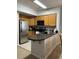 Well-equipped kitchen featuring stainless steel appliances and a breakfast bar at 4603 Arran Ct. # C, Myrtle Beach, SC 29579