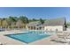 A community pool with lounge chairs offers a refreshing retreat with clear skies and lush surroundings at 4603 Arran Ct. # C, Myrtle Beach, SC 29579