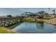 Waterfront restaurant with outdoor seating area, foot bridge, and scenic water view for relaxed dining at 5905 S Kings Hwy. # B-142, Myrtle Beach, SC 29575