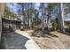 Spacious backyard with a screened-in porch and mature trees, perfect for outdoor activities at 6454 Sweet Gum Trail, Myrtle Beach, SC 29588
