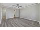 Neutral bedroom featuring light gray walls, neutral trim, and wood-look floors at 6454 Sweet Gum Trail, Myrtle Beach, SC 29588
