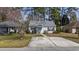Charming single-story home featuring a well-maintained yard and a spacious concrete driveway at 6454 Sweet Gum Trail, Myrtle Beach, SC 29588