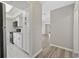 View into kitchen showcasing white cabinets and appliances from adjacent hallway at 6454 Sweet Gum Trail, Myrtle Beach, SC 29588