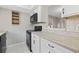 Kitchen with black appliances, light countertops, white cabinets, and tile flooring at 6454 Sweet Gum Trail, Myrtle Beach, SC 29588