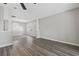 Bright living room featuring light gray walls, wood-look floors and neutral trim at 6454 Sweet Gum Trail, Myrtle Beach, SC 29588